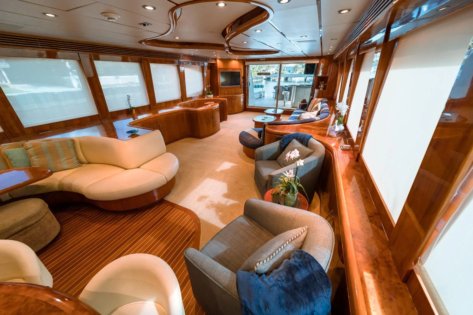 a room with couches and chairs aboard DREAM ON Yacht for Sale