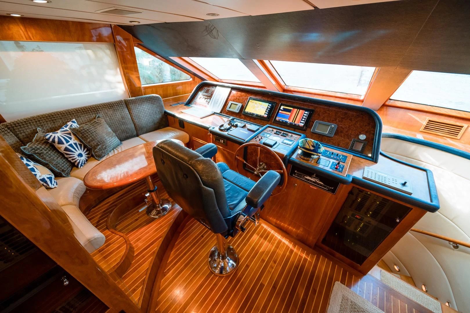a room with a couch and a desk with a laptop on it aboard DREAM ON Yacht for Sale