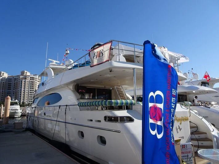 a large boat with a surfboard aboard DREAM ON Yacht for Sale