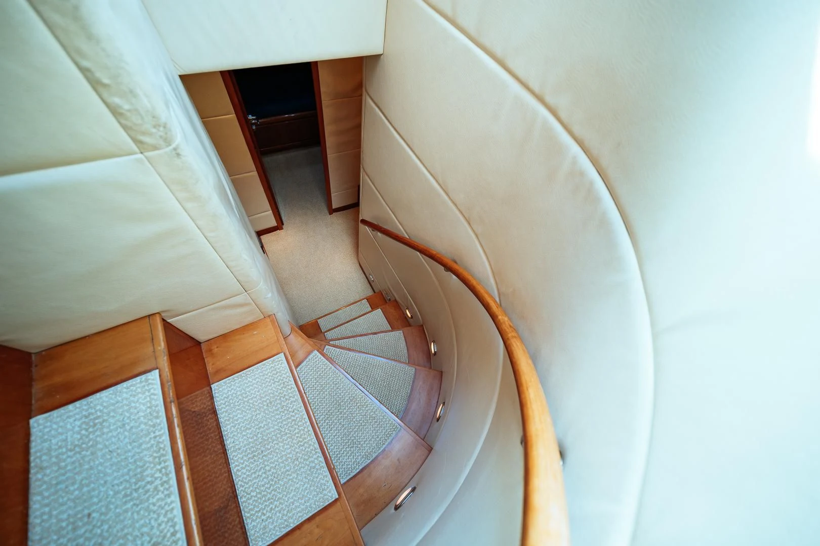 a staircase with a wood railing aboard DREAM ON Yacht for Sale