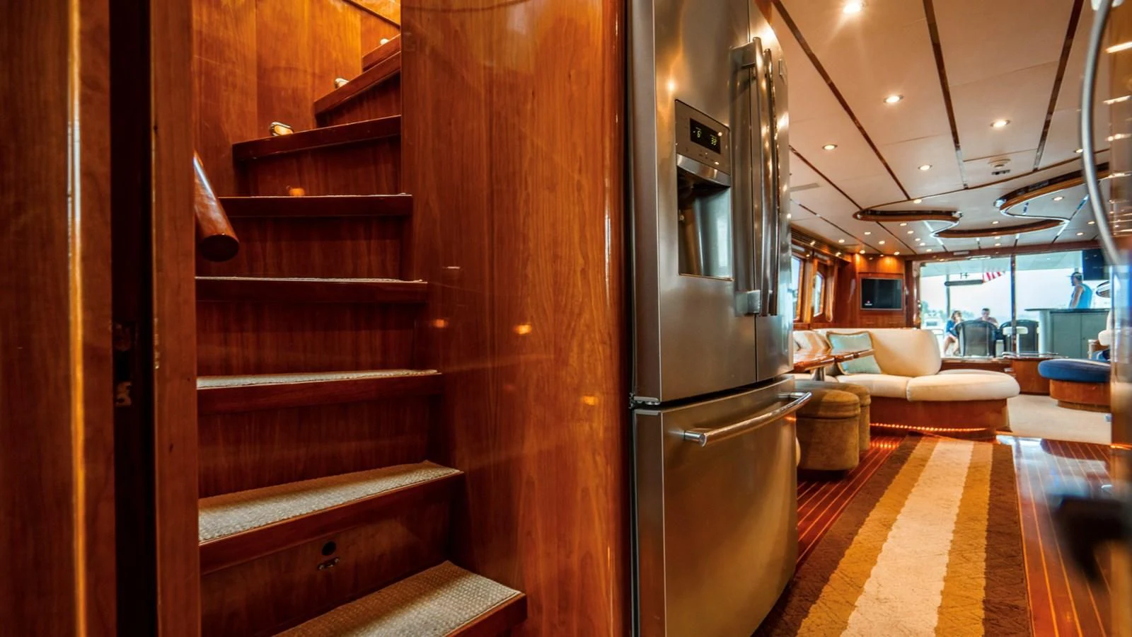 a room with a refrigerator and a couch aboard DREAM ON Yacht for Sale