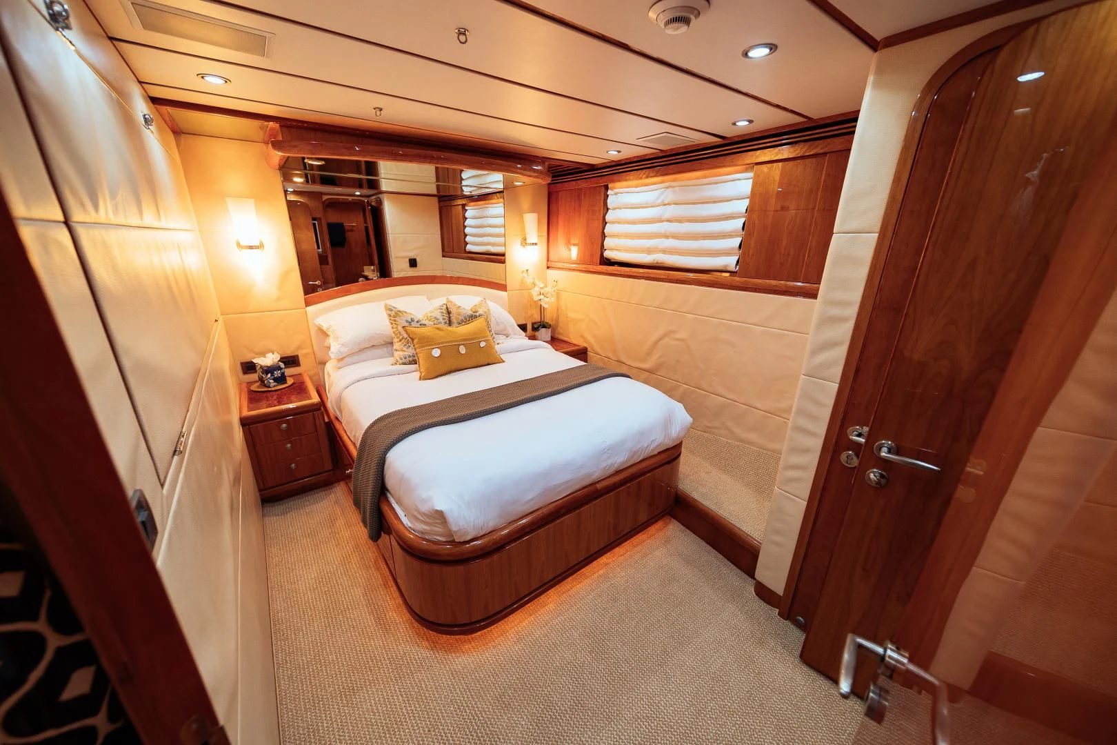 a room with a bed and a mirror aboard DREAM ON Yacht for Sale