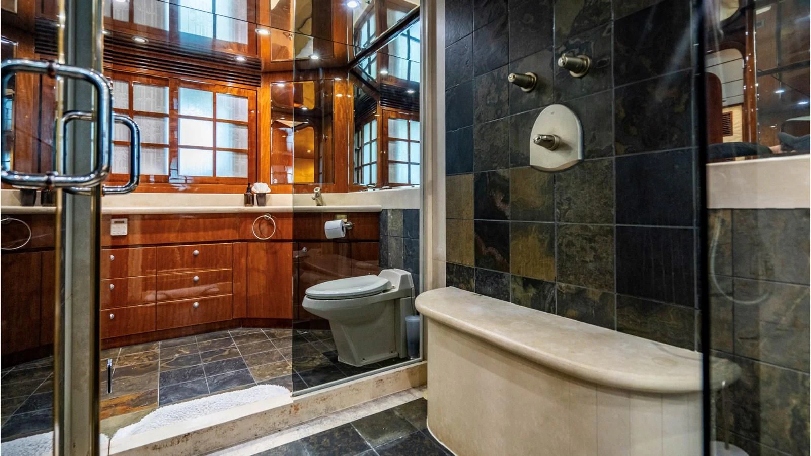 a bathroom with a tub and toilet aboard DREAM ON Yacht for Sale