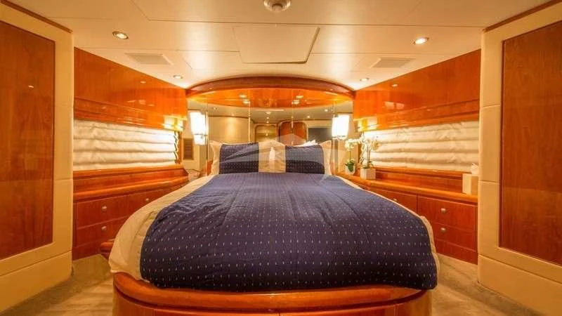 a room with a bed and a desk aboard DREAM ON Yacht for Sale