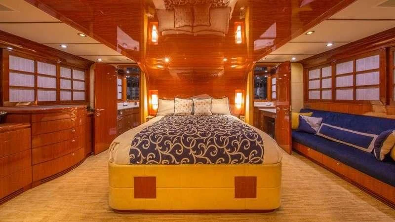 a room with a bed and a wood wall aboard DREAM ON Yacht for Sale