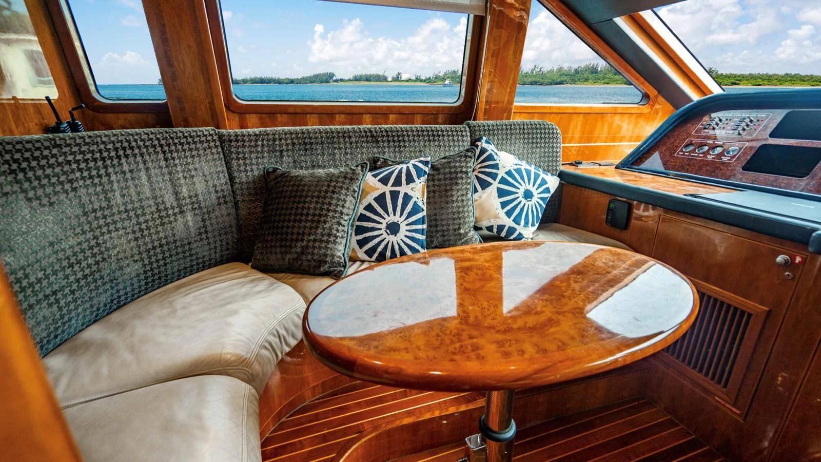a couch with pillows and a table aboard DREAM ON Yacht for Sale