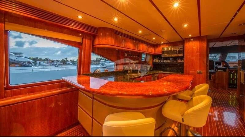 a bar with a table and chairs aboard DREAM ON Yacht for Sale