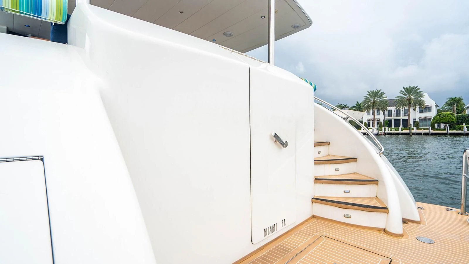 a white boat on a dock aboard DREAM ON Yacht for Sale