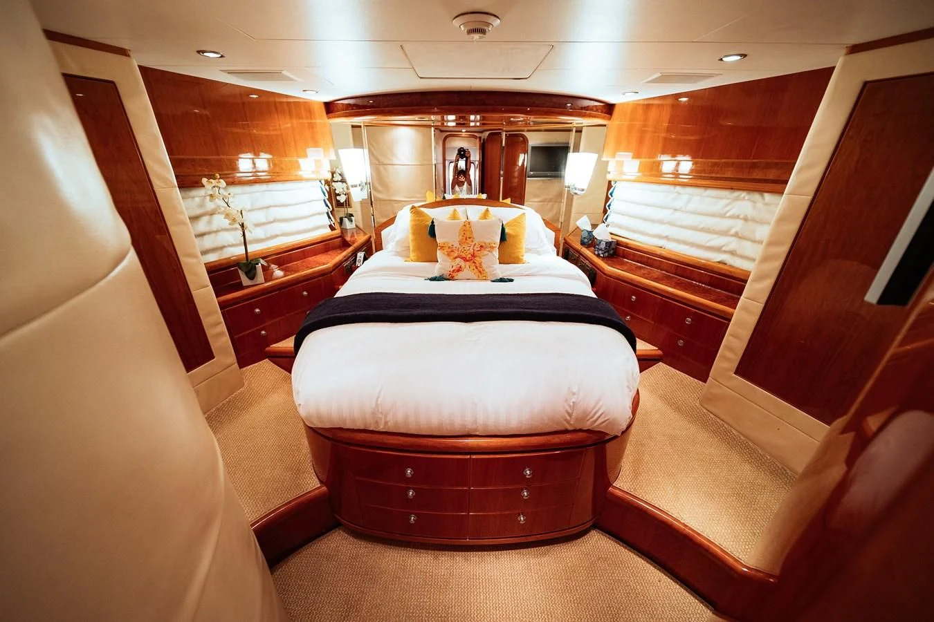 a room with a bed and a mirror aboard DREAM ON Yacht for Sale