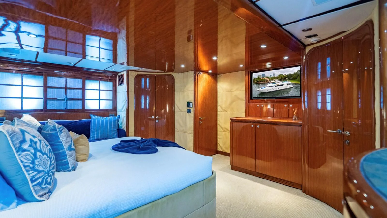 a room with a bed and a wood door aboard DREAM ON Yacht for Sale