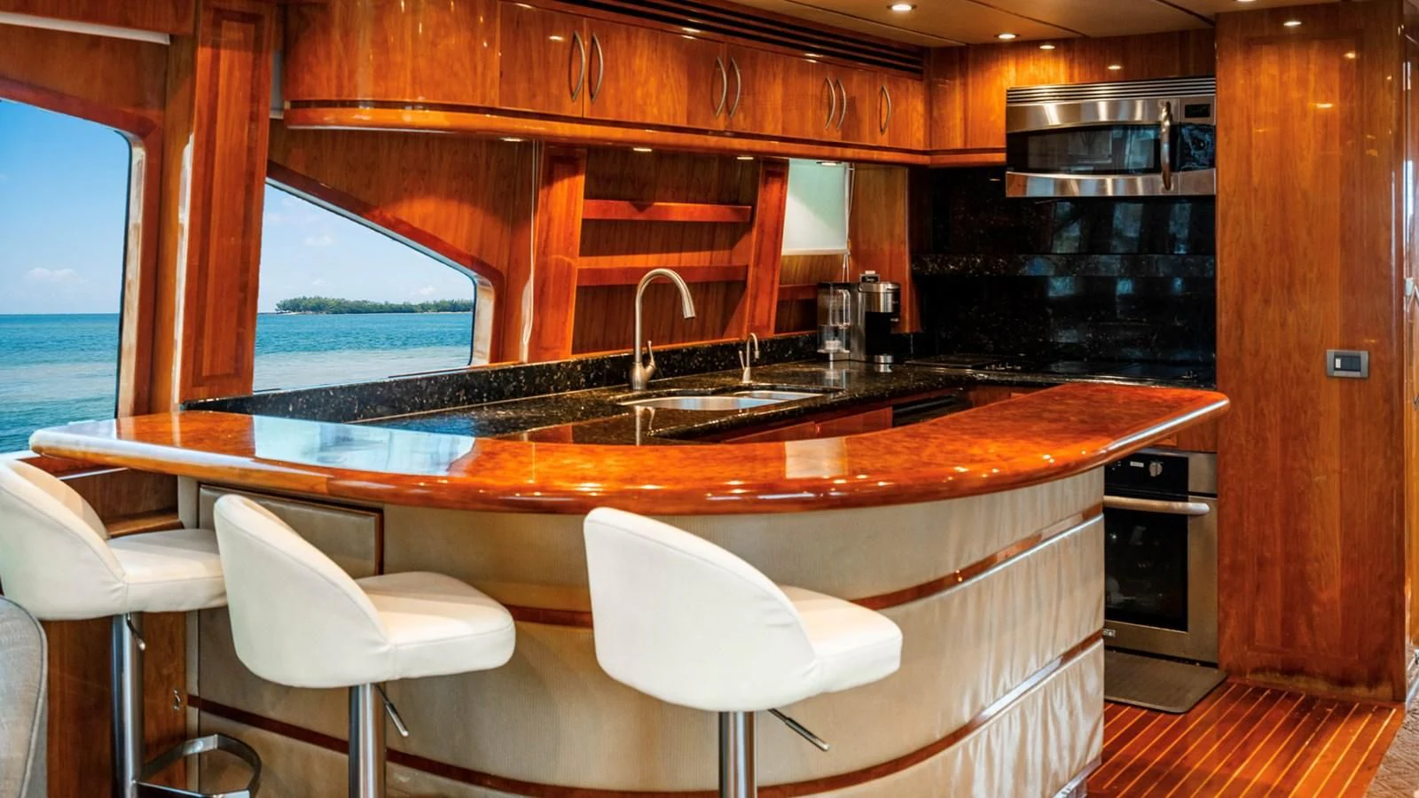 a kitchen with a large island aboard DREAM ON Yacht for Sale