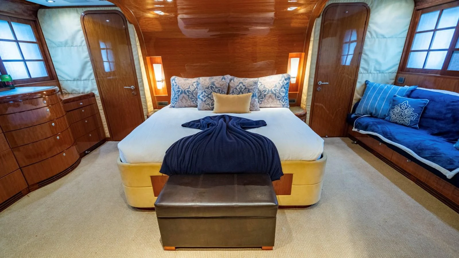 a bedroom with a bed and a couch aboard DREAM ON Yacht for Sale