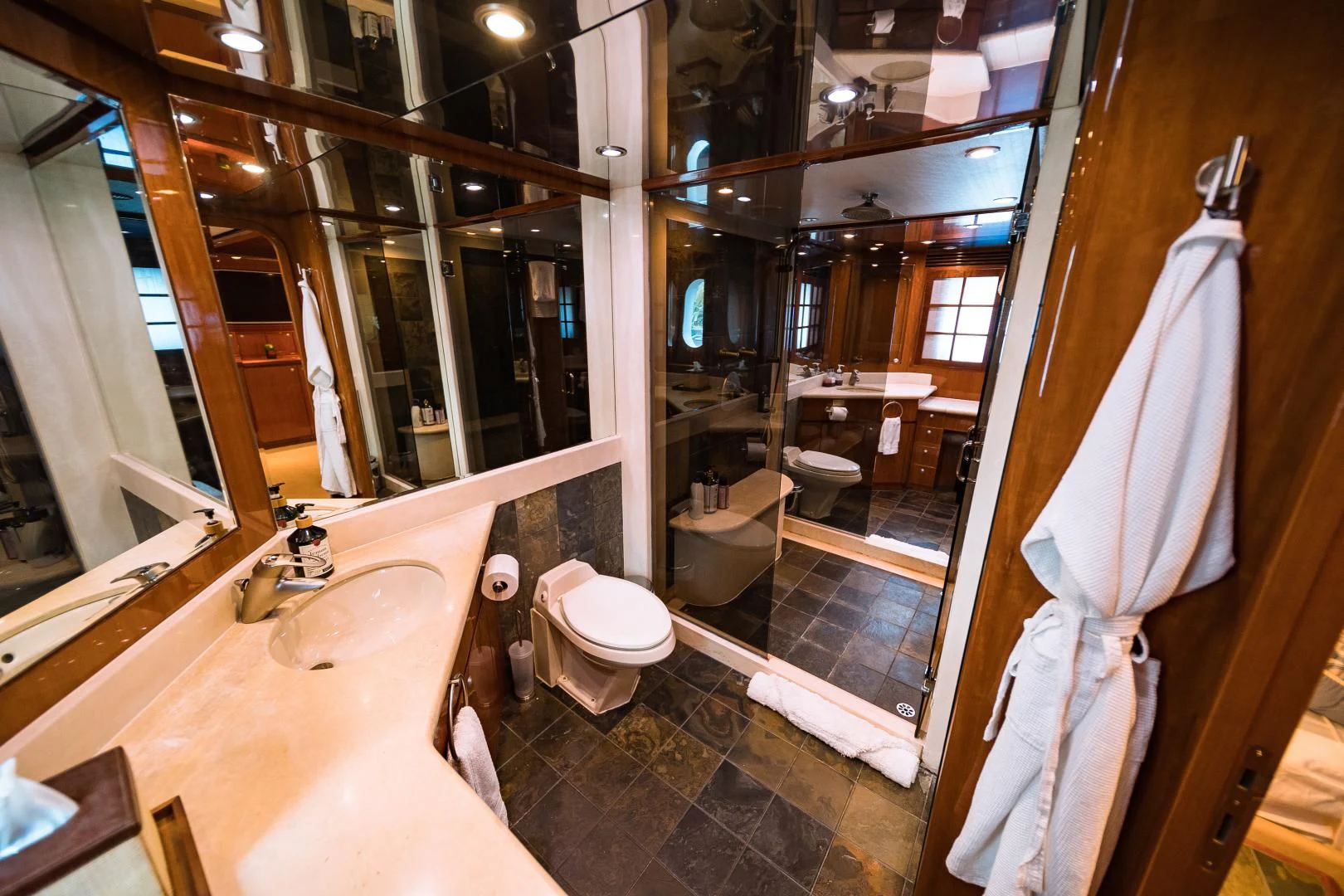 a bathroom with a large mirror aboard DREAM ON Yacht for Sale