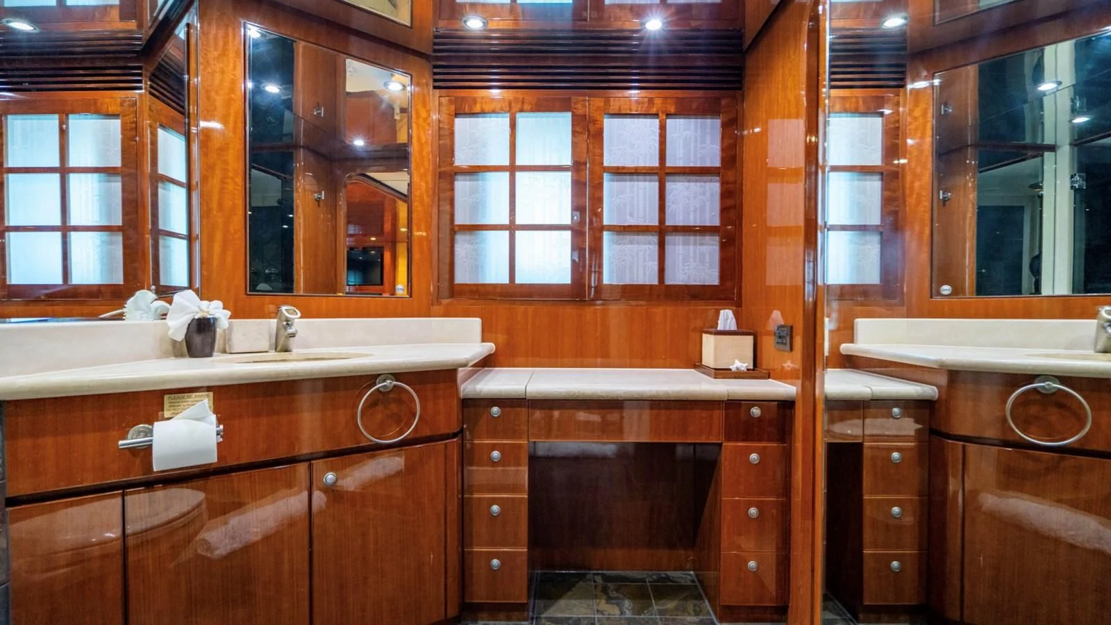 a bathroom with wooden cabinets aboard DREAM ON Yacht for Sale