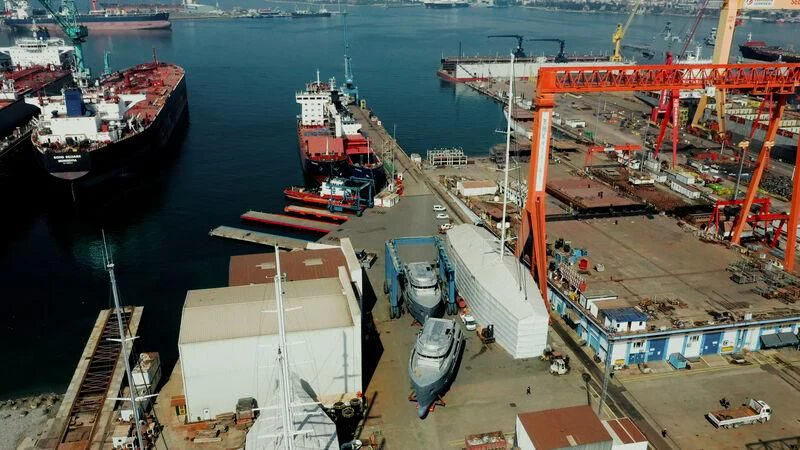 a large cargo ship docked aboard BERING 88/05 Yacht for Sale