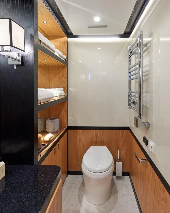 a bathroom with a toilet and a sink aboard BERING 88/05 Yacht for Sale