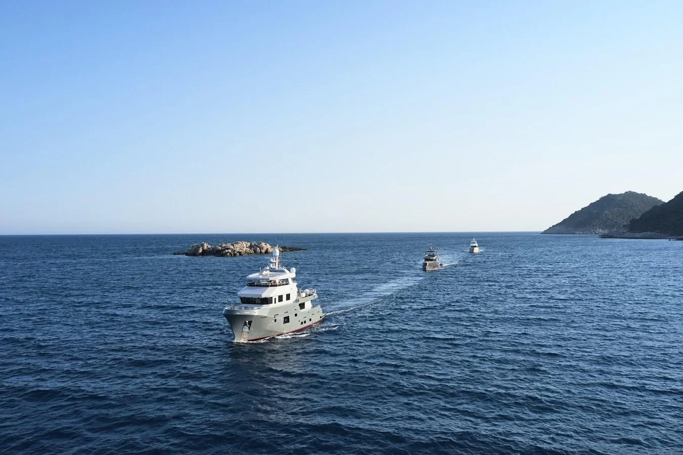 a couple of boats in the water aboard BERING 88/05 Yacht for Sale