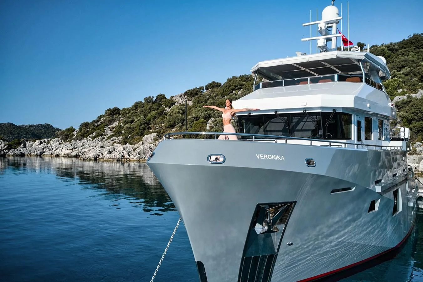 a man and a woman on a boat aboard BERING 88/05 Yacht for Sale