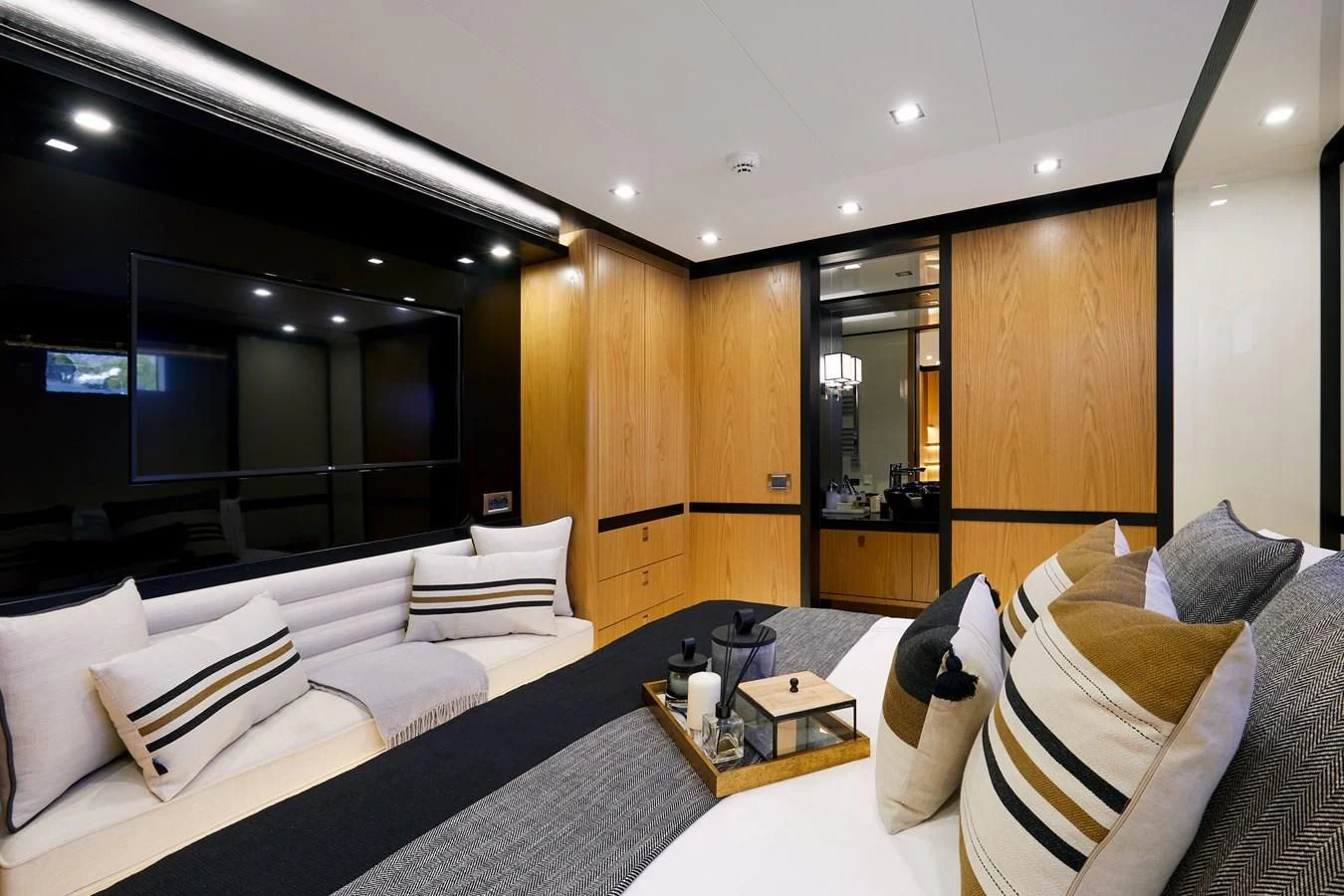 a room with a bed and a table aboard BERING 88/05 Yacht for Sale