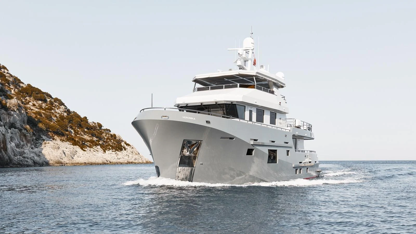 a white boat on the water aboard BERING 88/05 Yacht for Sale