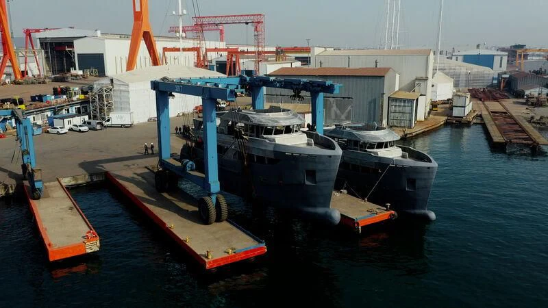 a large ship docked at a port aboard BERING 88/05 Yacht for Sale