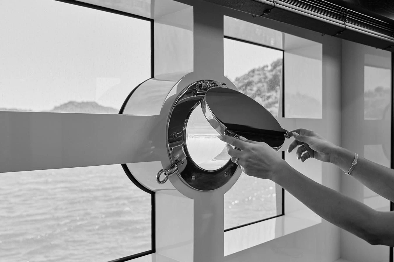 a person wearing a hat and holding a glass aboard BERING 88/05 Yacht for Sale