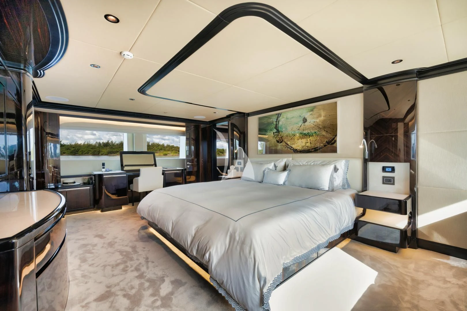 a room with a bed and a table aboard PERSISTENCE Yacht for Sale