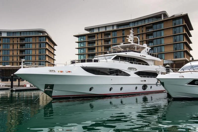 a couple of boats are parked in a harbor aboard PERSISTENCE Yacht for Sale