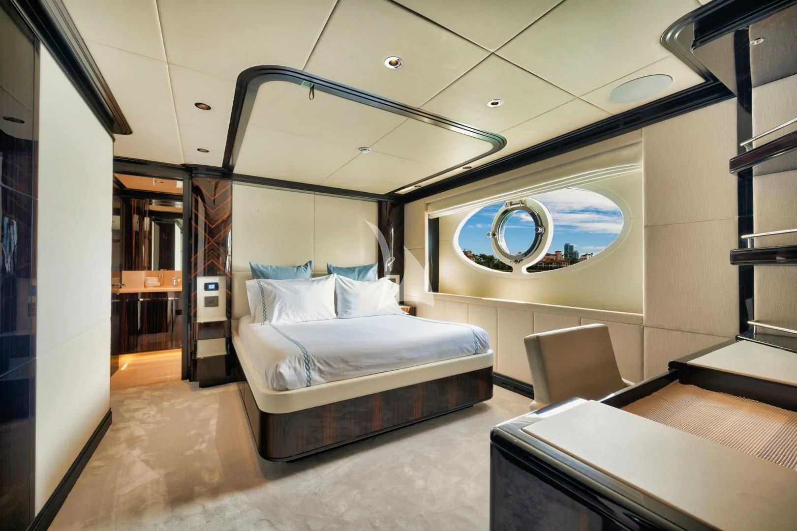 a room with a bed and a desk aboard PERSISTENCE Yacht for Sale