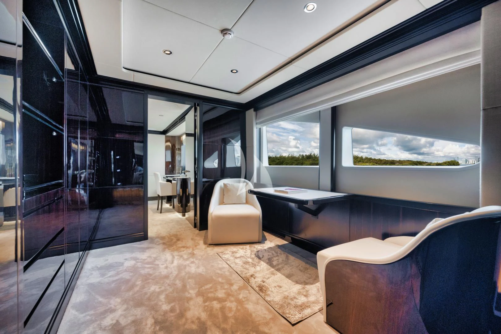 a room with a couch and a table and chairs aboard PERSISTENCE Yacht for Sale