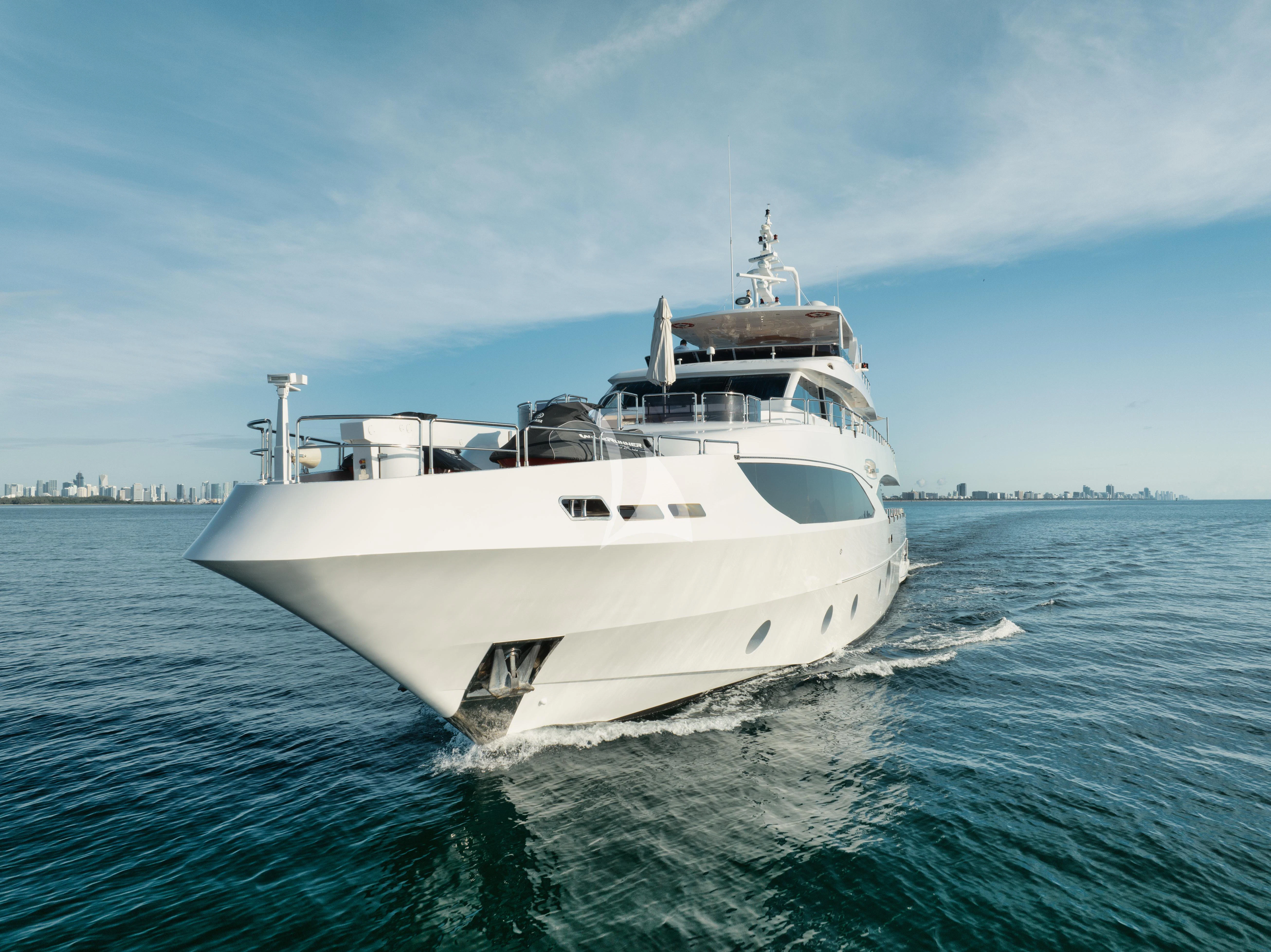 a white boat in the water aboard PERSISTENCE Yacht for Sale