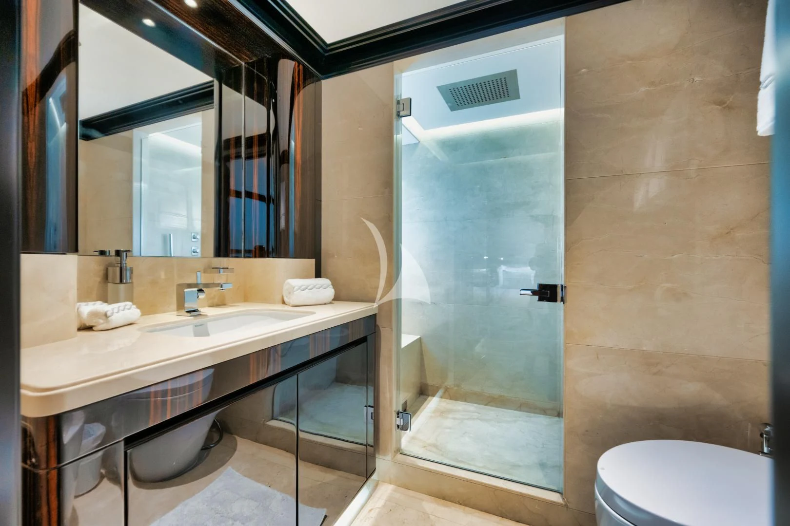 a bathroom with a glass shower aboard PERSISTENCE Yacht for Sale