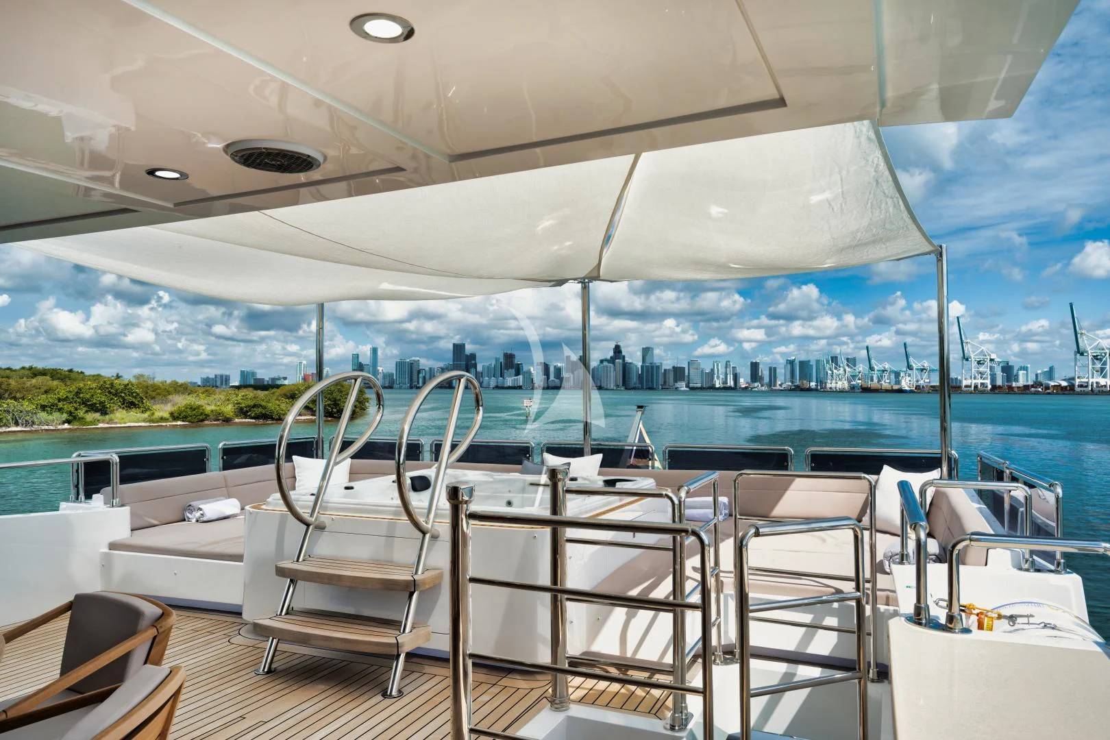 a large white tent with chairs and tables on a deck aboard PERSISTENCE Yacht for Sale