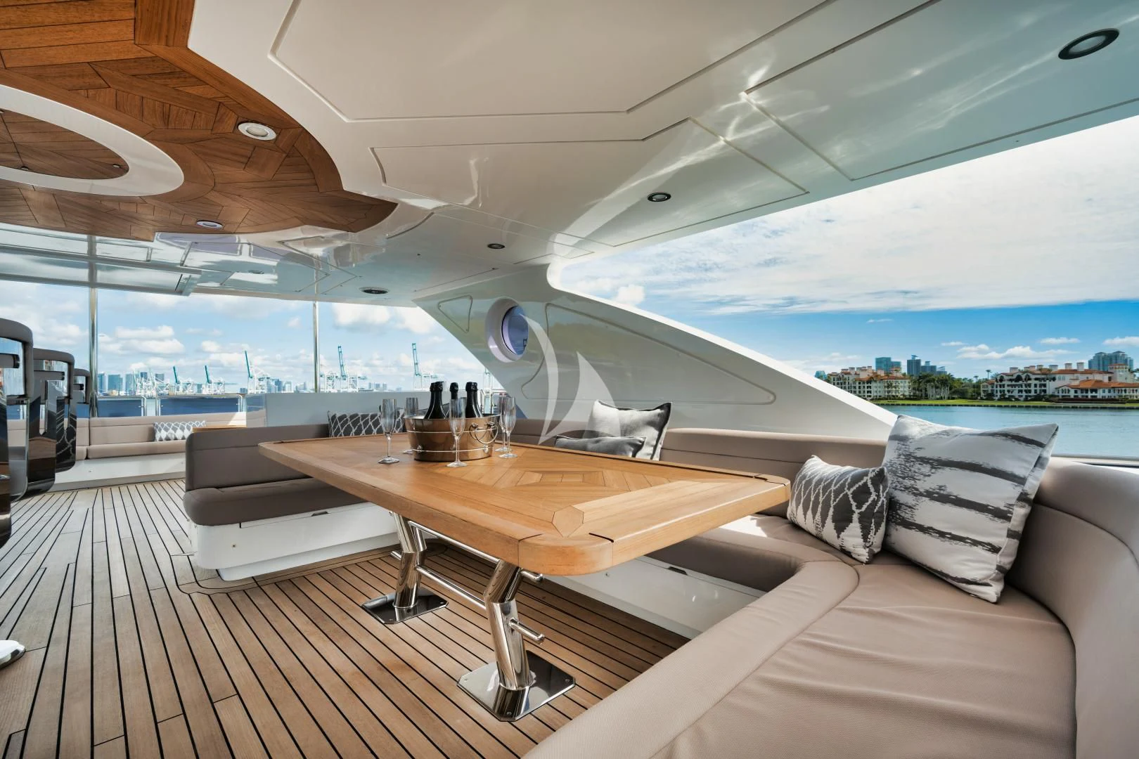 a room with a table and a couch aboard PERSISTENCE Yacht for Sale