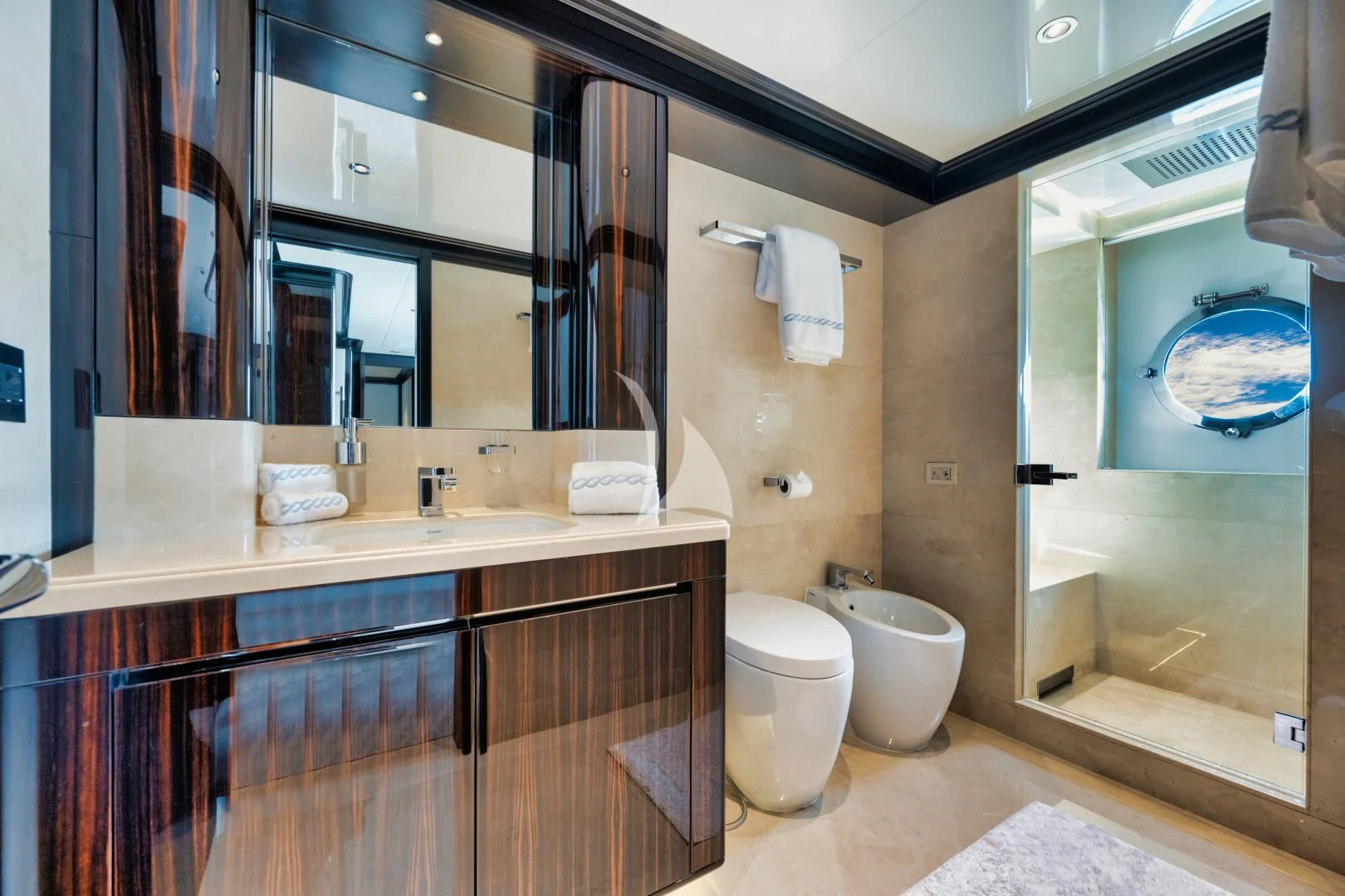 a bathroom with a large mirror aboard PERSISTENCE Yacht for Sale