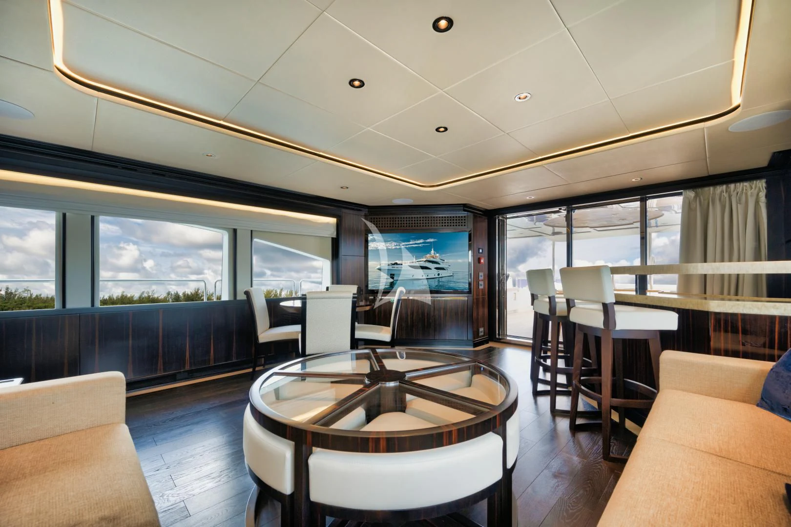 a room with a table and chairs aboard PERSISTENCE Yacht for Sale