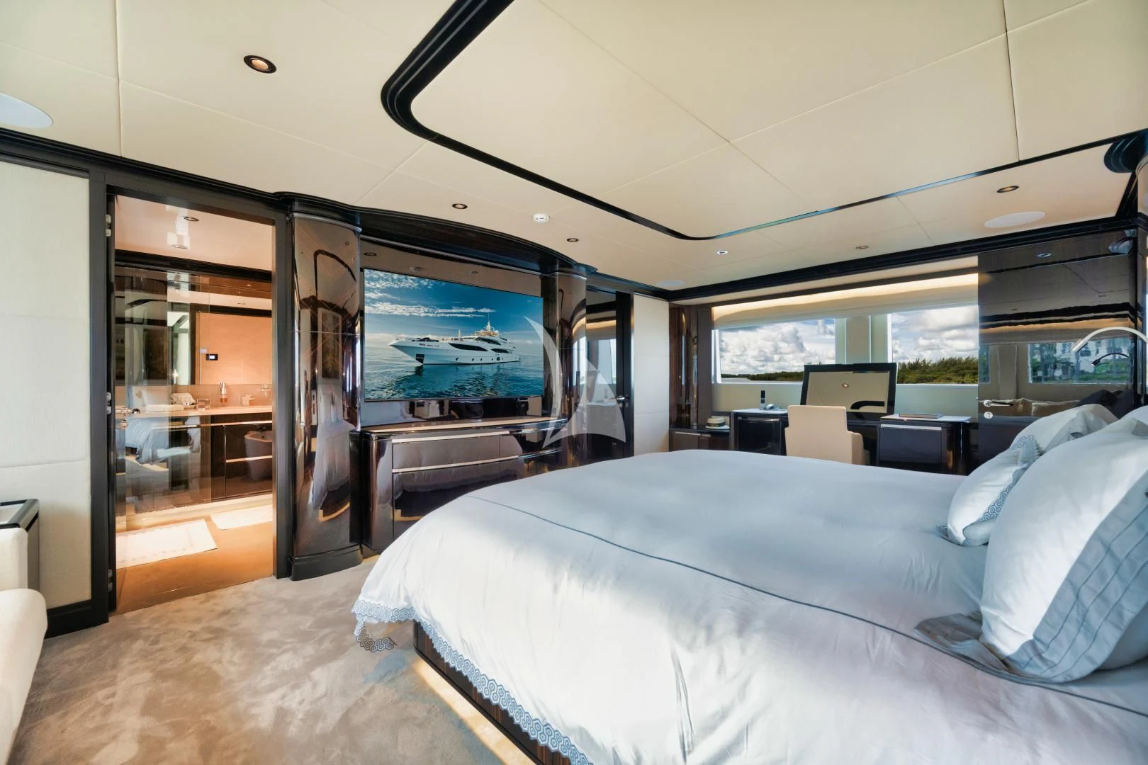 a room with a bed and a large window aboard PERSISTENCE Yacht for Sale