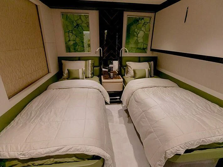 a couple of beds in a room aboard PERSISTENCE Yacht for Sale