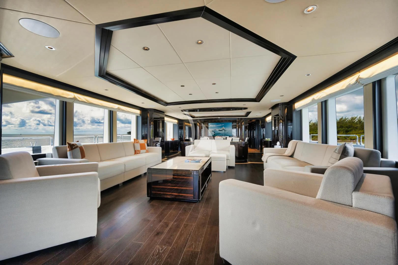 a room with couches and a table aboard PERSISTENCE Yacht for Sale
