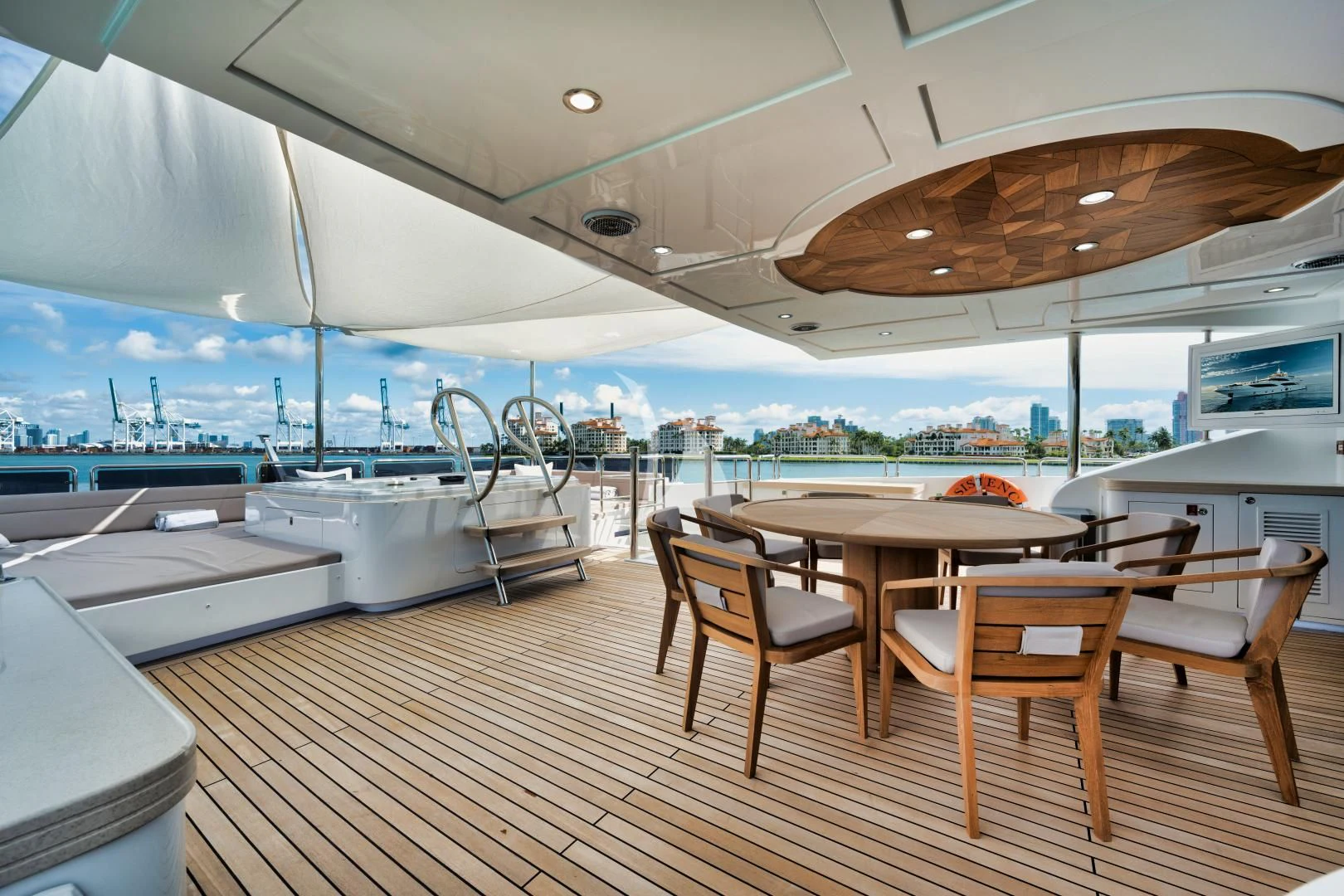 a room with a table and chairs aboard PERSISTENCE Yacht for Sale