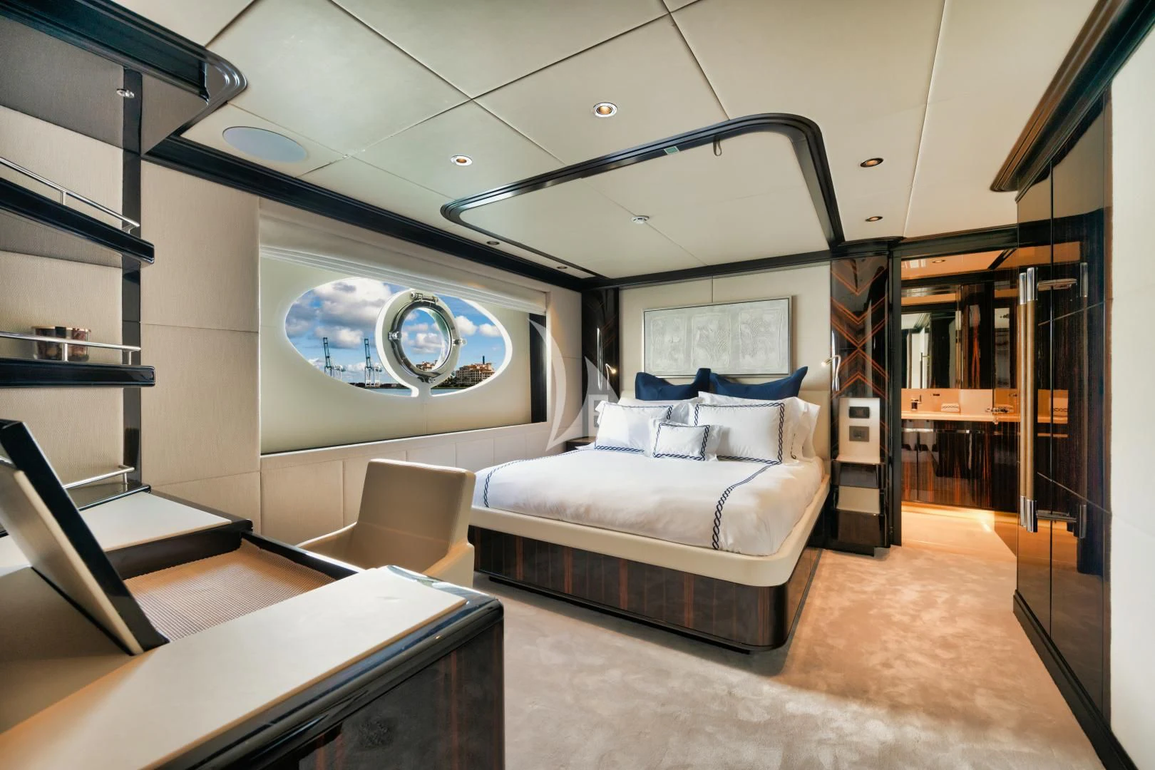 a room with a bed and a desk aboard PERSISTENCE Yacht for Sale