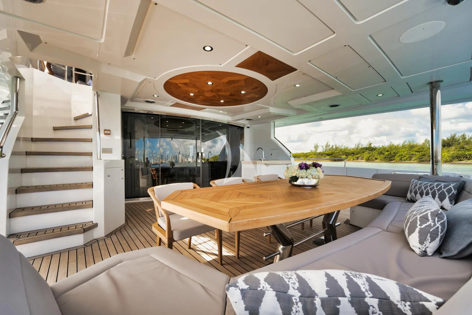 a modern looking living room with a large table and chairs aboard PERSISTENCE Yacht for Sale