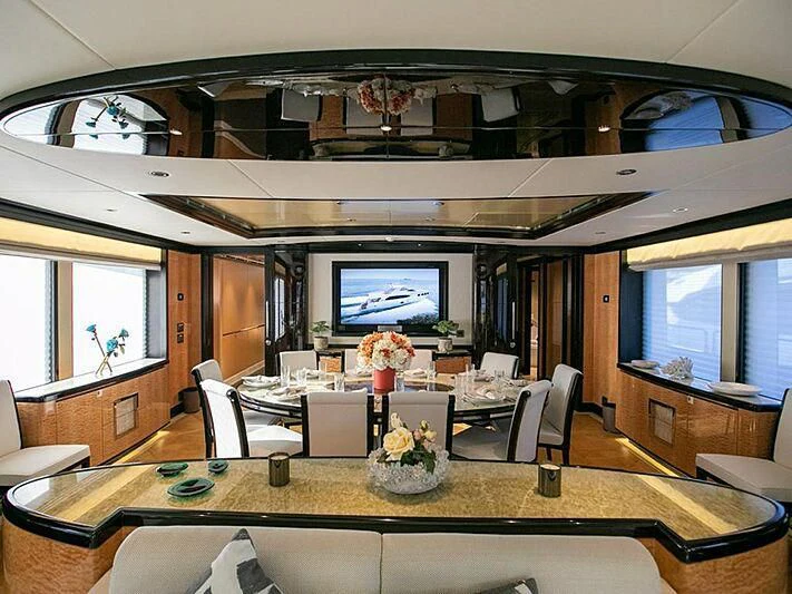 a dining room with a large table aboard PERSISTENCE Yacht for Sale