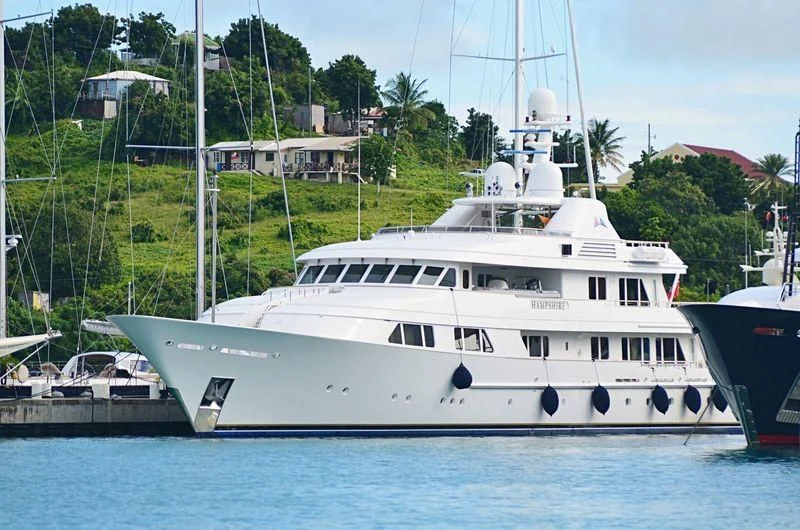 a white boat in the water aboard AMBITION Yacht for Sale