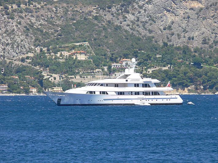 a white boat on the water aboard AMBITION Yacht for Sale
