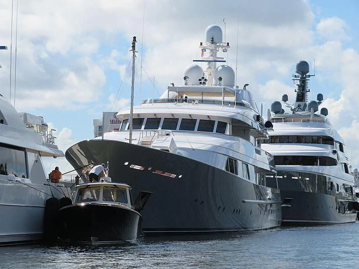 a group of large boats in the water aboard AMBITION Yacht for Sale