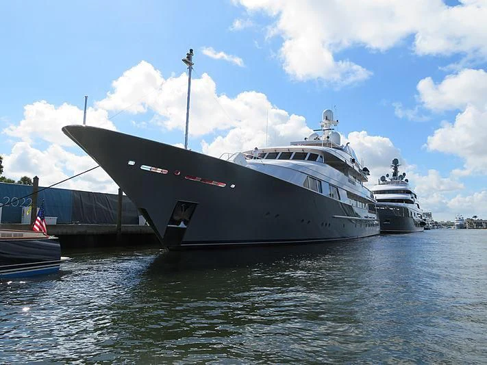 a large white ship docked aboard AMBITION Yacht for Sale