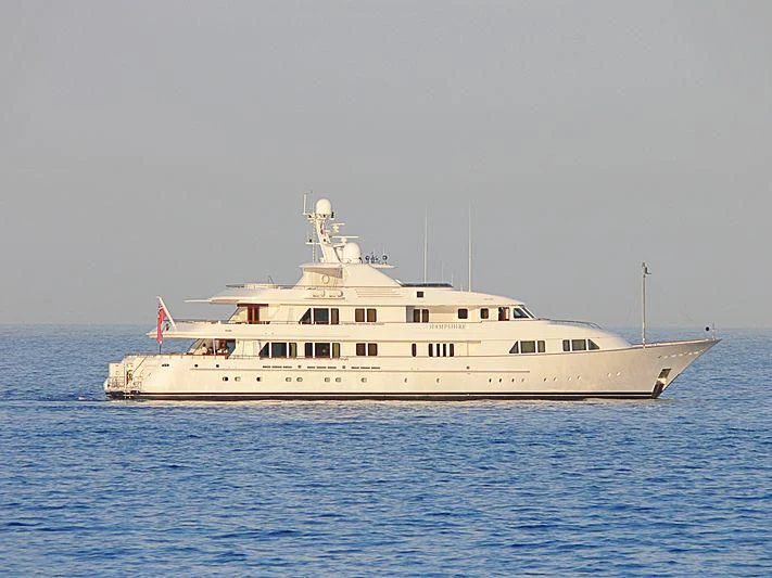 a large white boat in the water aboard AMBITION Yacht for Sale