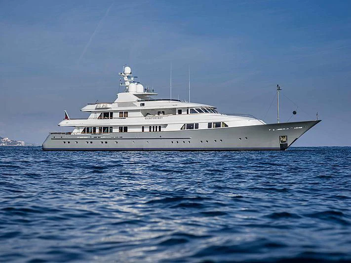 a white boat in the water aboard AMBITION Yacht for Sale