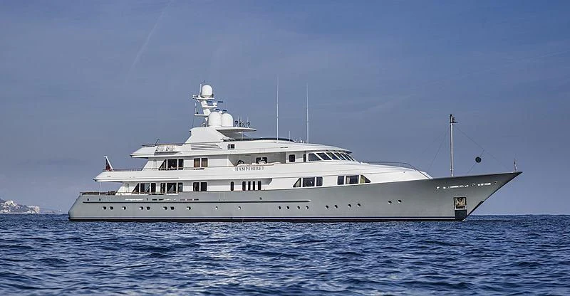 a large white boat in the water aboard AMBITION Yacht for Sale
